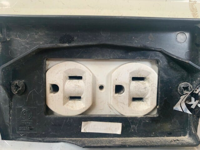 Observing the power outlet on a Travel Trailer. Needs Maintenance!
