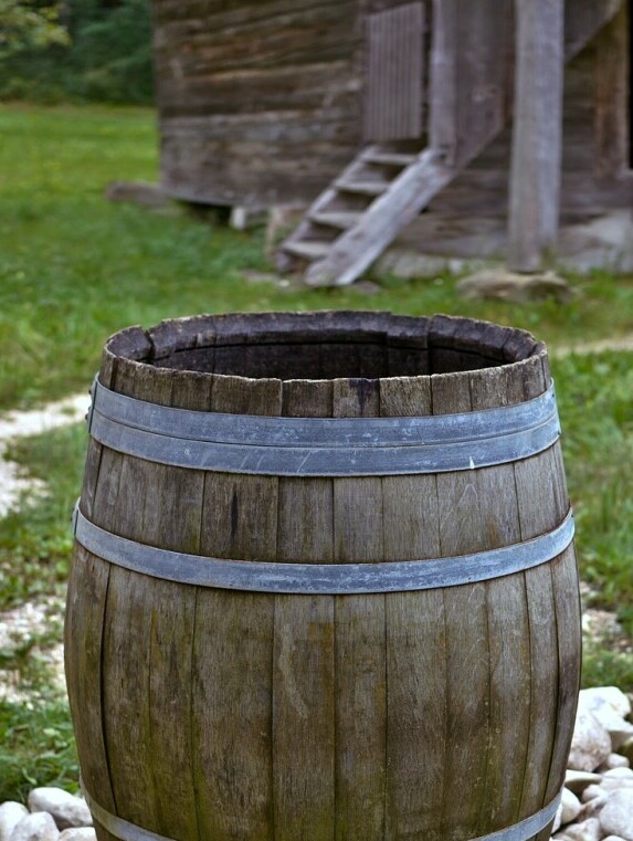 collecting rain in a barrel