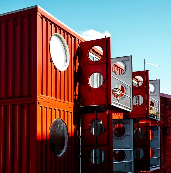 Shipping container with window and door