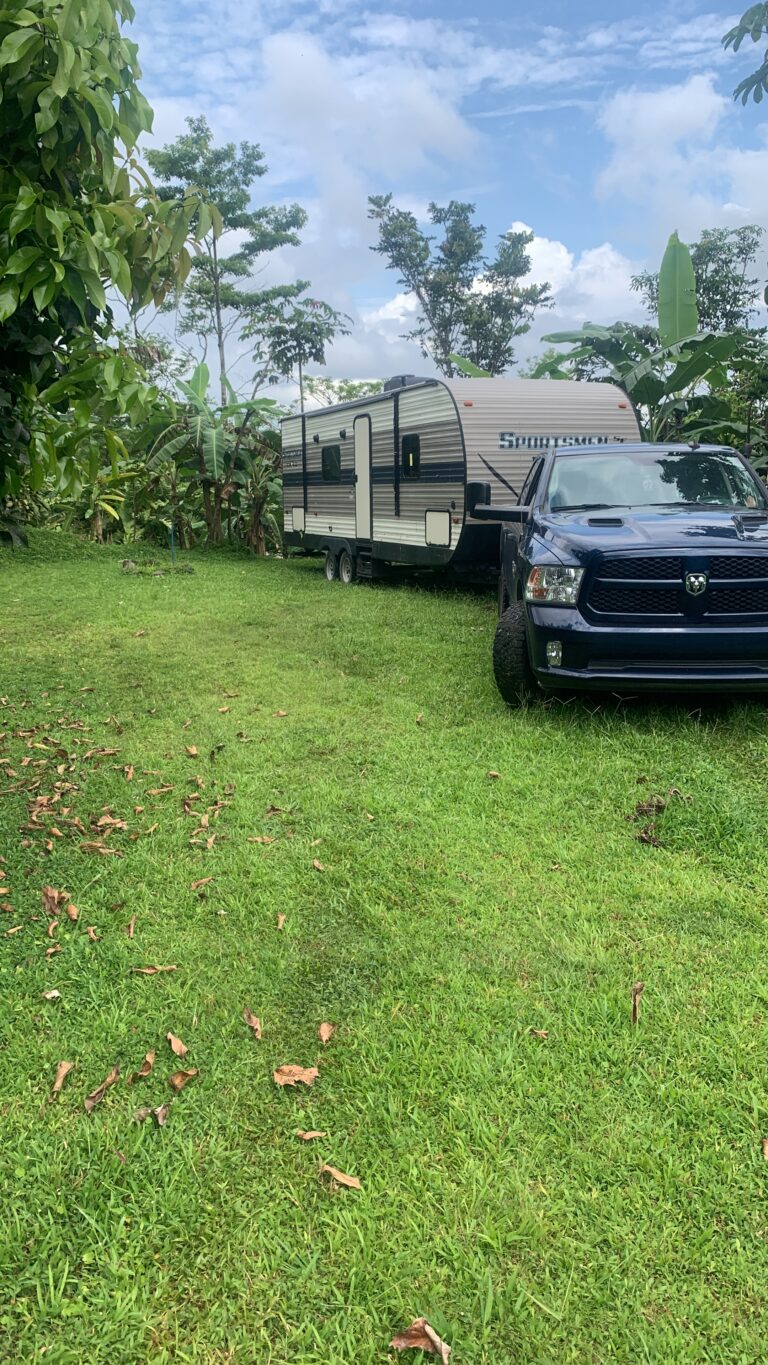 2020 Ram 1500 towing a KZ Sportsmen travel trailer at a campground in Costa Rica